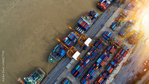 Container ship in import export and business logistics, By crane, Trade Port, Shipping cargo to harbor, Aerial view from drone, International transportation, Business logistics concept