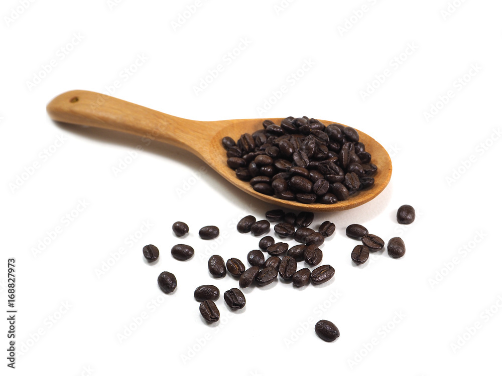 Coffee beans on wooden spoon on white background Coffee beans on wooden spoon on white background