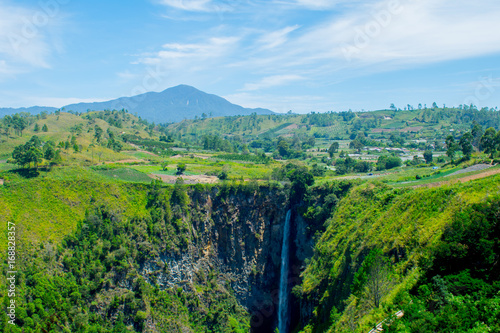 Sipiso-piso waterfall, is one of the tallest waterfall in Indonesia. The name Sipiso-piso mean ‘like a knife' it has 120m high and it located in Tonggiang village, 45 Kilometers from Berastagi. photo