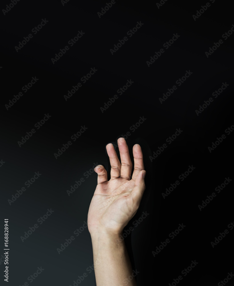 Fototapeta premium Hand opening on black vertical background