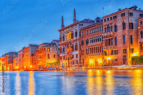 Views of the most beautiful canal of Venice - Grand Canal water streets, boats, gondolas, mansions along. Night view. Italy. © BRIAN_KINNEY
