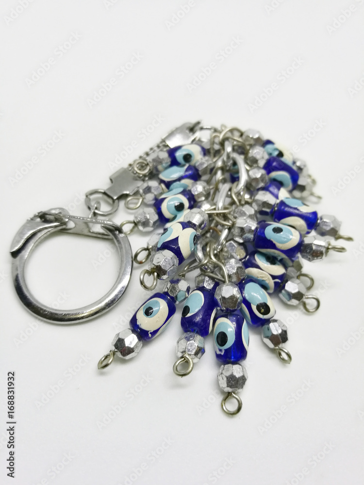 Variety of key chains from countries on a white background with selective focus Variety of key chains from countries on a white background with selective focus