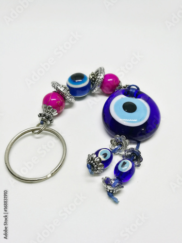 Variety of key chains from countries on a white background with selective focus