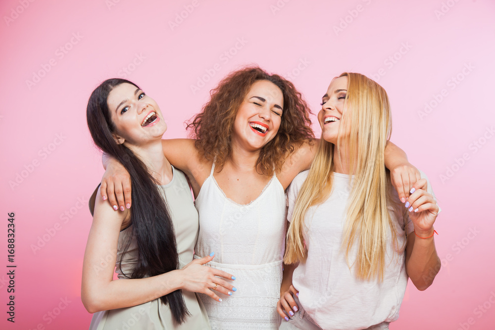 Three young women laughing and having fun Three young women laughing and having fun