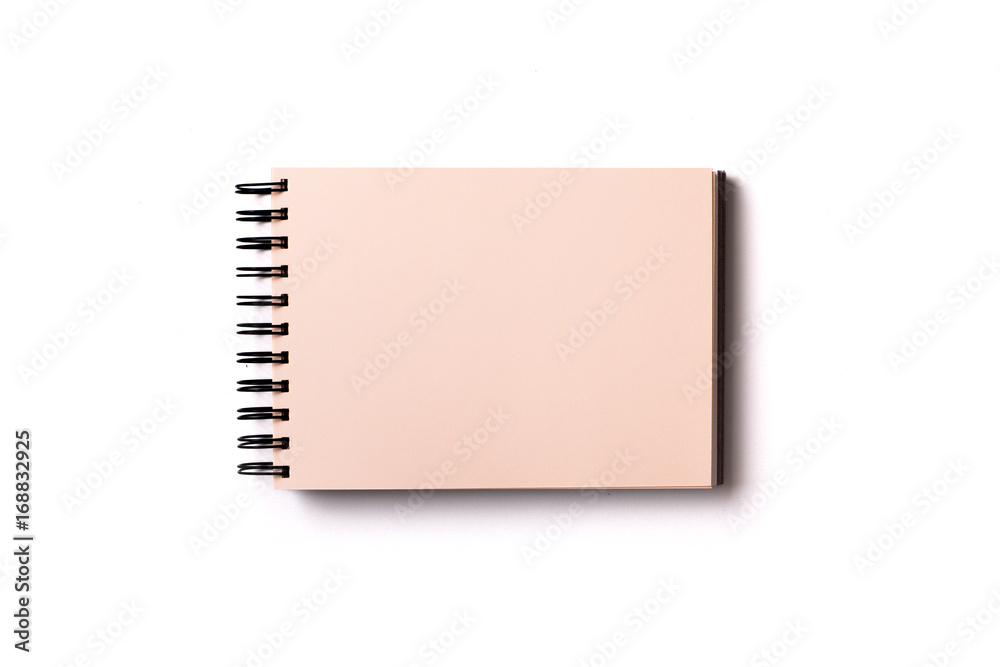 Horizontal aligned isolated sketchbook mock up with blank yellow sheets on white background. Top view, flat lay. Horizontal aligned isolated sketchbook mock up with blank yellow sheets on white background. Top view, flat lay.
