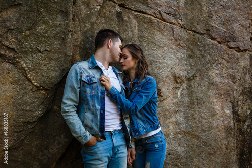 Lovers in jeans walk and laugh at the rocks, canyon