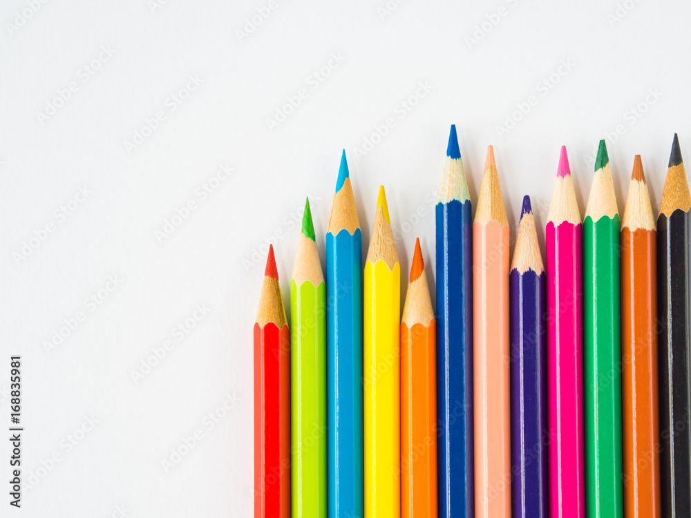 Closeup colorful pencils on white background. Back to school concept. Closeup colorful pencils on white background. Back to school concept.