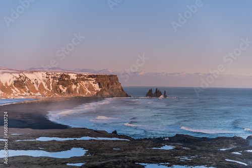 View over Reynisfjara or black beach during sunset
