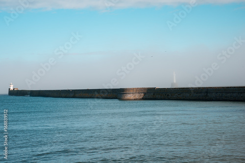 Lighthouse hiding in a haze in Aberdeen Harbour entrance