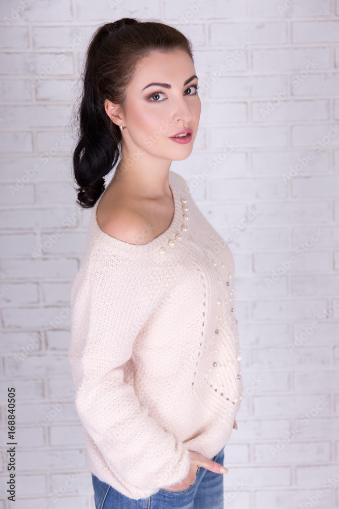 cute beautiful woman over white brick wall cute beautiful woman over white brick wall