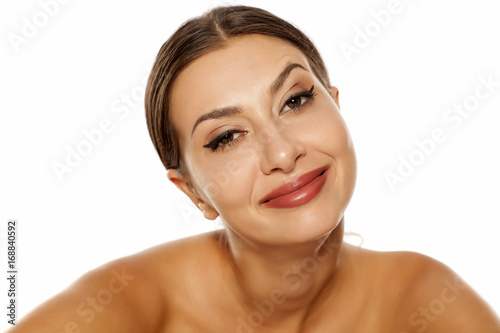 carefree young woman with a satisfied expression