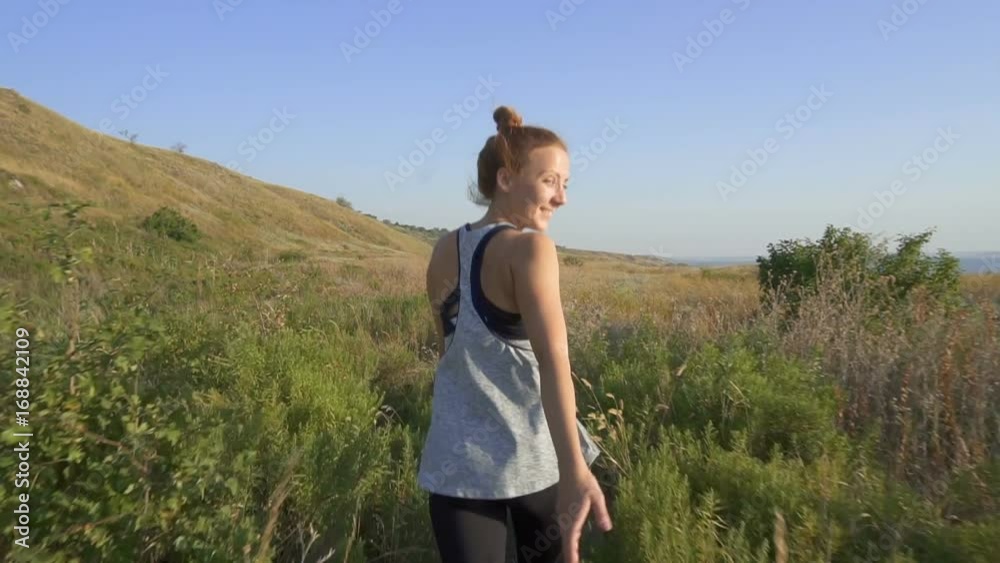 Happy woman having fun running in field nature excited of joy happiness Happy woman having fun running in field nature excited of joy happiness
