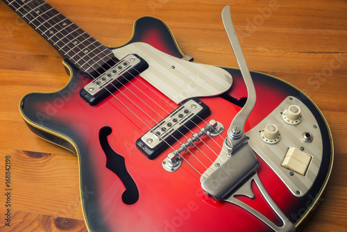 Vintage Electric Guitar On A Wooden Surface
