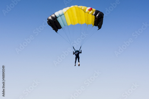 Skydiver in clean sky with copy space