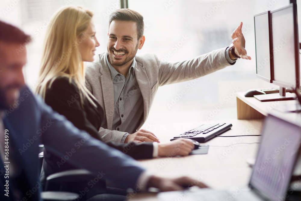 Portrait of cheerful business couple working on computer Portrait of cheerful business couple working on computer