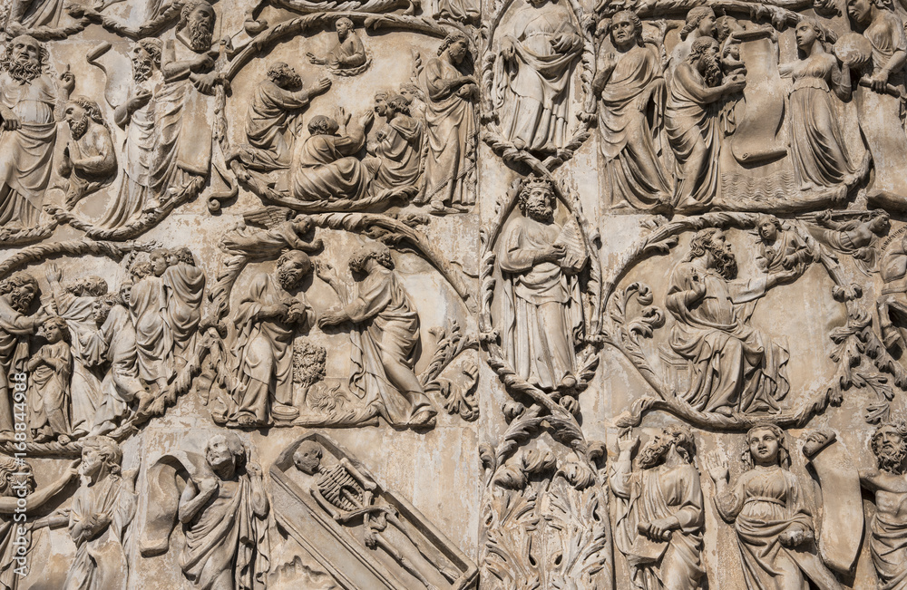  ORVIETO, ITALY - JULY 2017- Close-up of the opulent and elaborated embossed sculptures in the Orvieto Cathedral (Duomo)