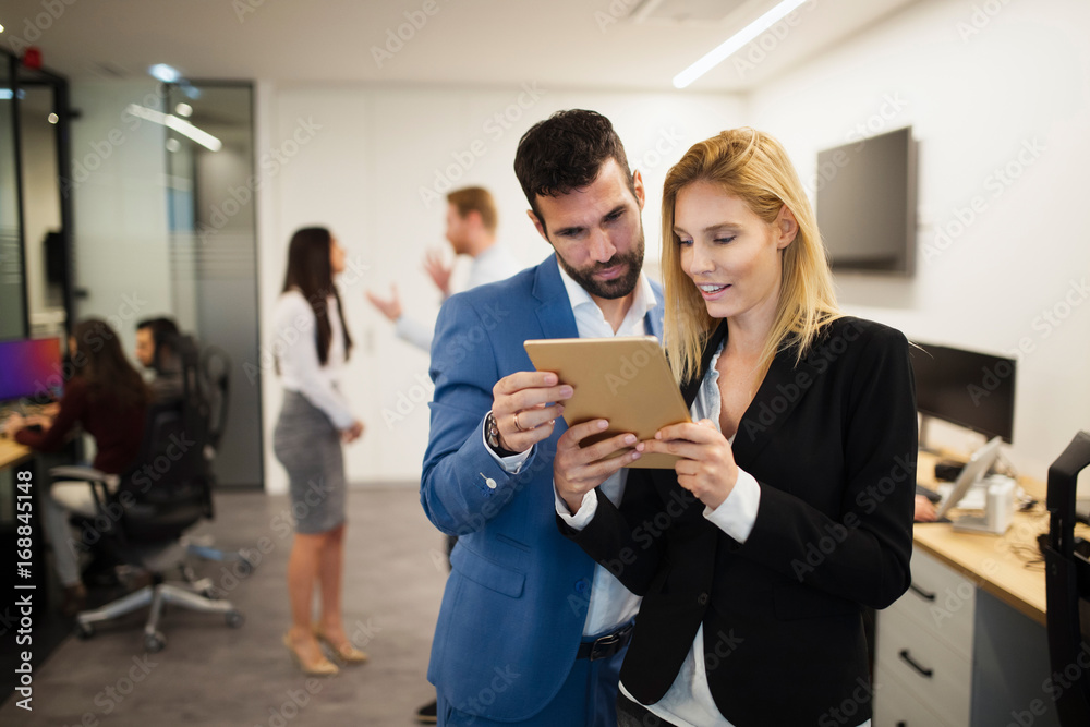 Portrait of attractive business partners using tablet Portrait of attractive business partners using tablet