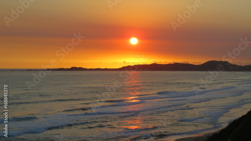 Beautiful orange sunset landscape at the sea in South africa.  © Jennifer