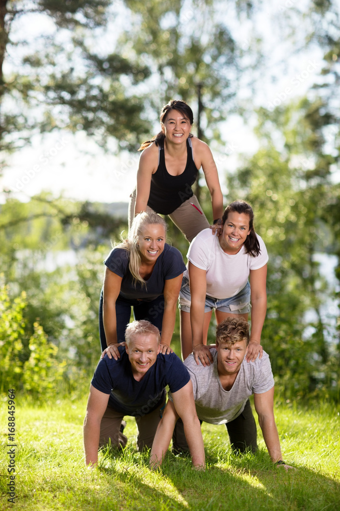Portrait Of Multiethnic Business People Making Human Pyramid On Portrait Of Multiethnic Business People Making Human Pyramid On