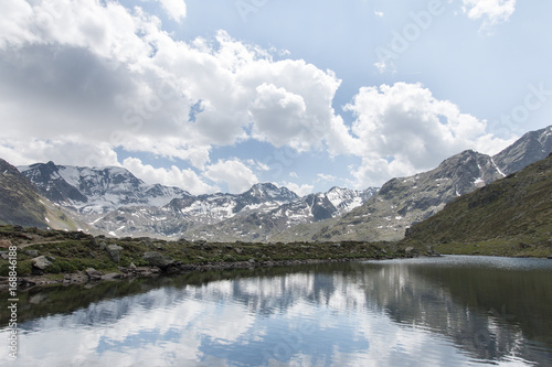 View at the mountains with mountain lake and reflection