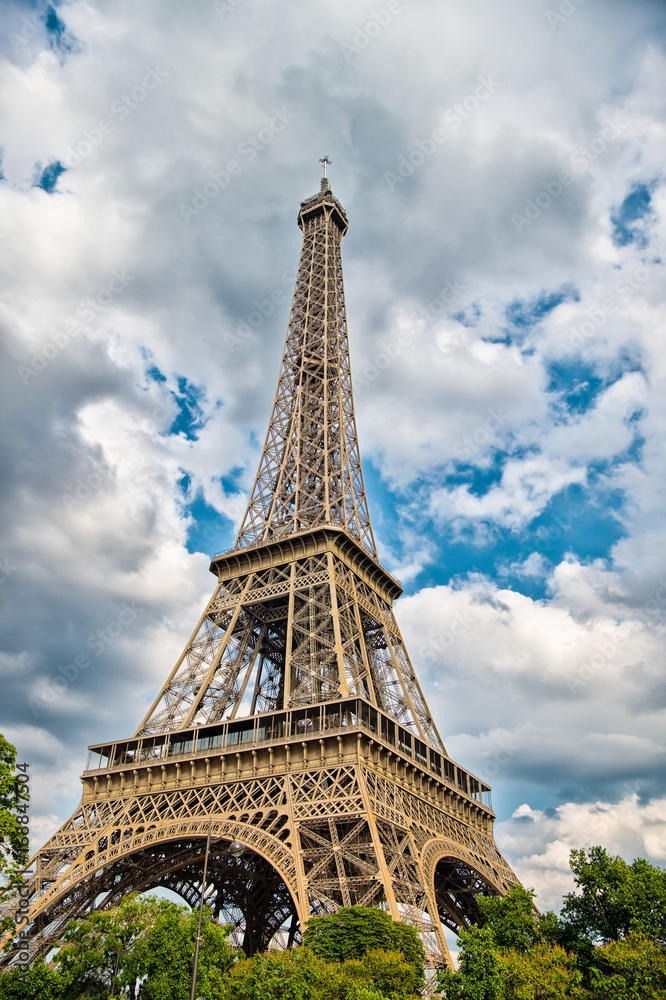 Eiffel Tower at sunset in Paris, France. HDR. Romantic travel background.