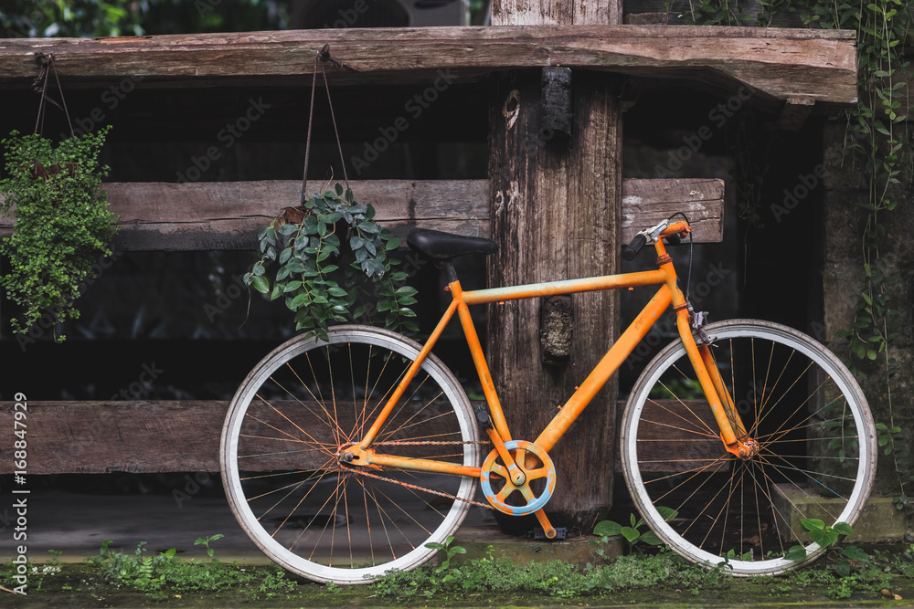Old fixie bicycle as decoration of hotel in village rustic style in Bali tropical nature