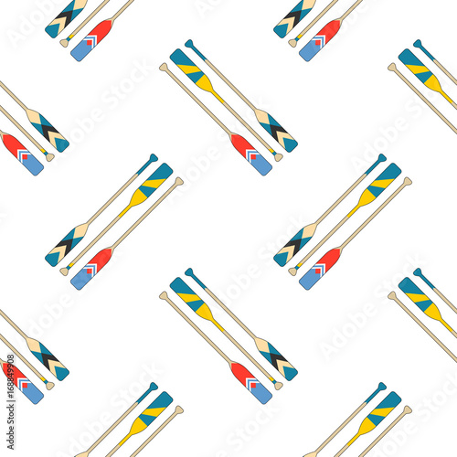 Colorful oars in red, blue, yellow slant on white background. Seamless pattern.