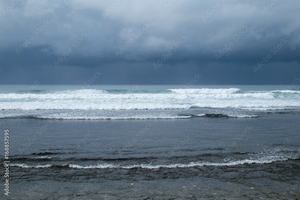 rain over the sea at Krakal beach Yogyakarta rain over the sea at Krakal beach Yogyakarta