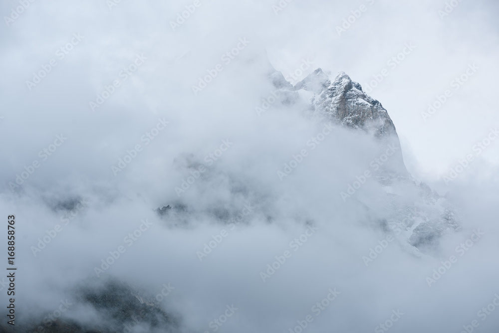 Mountain peak in the clouds Mountain peak in the clouds