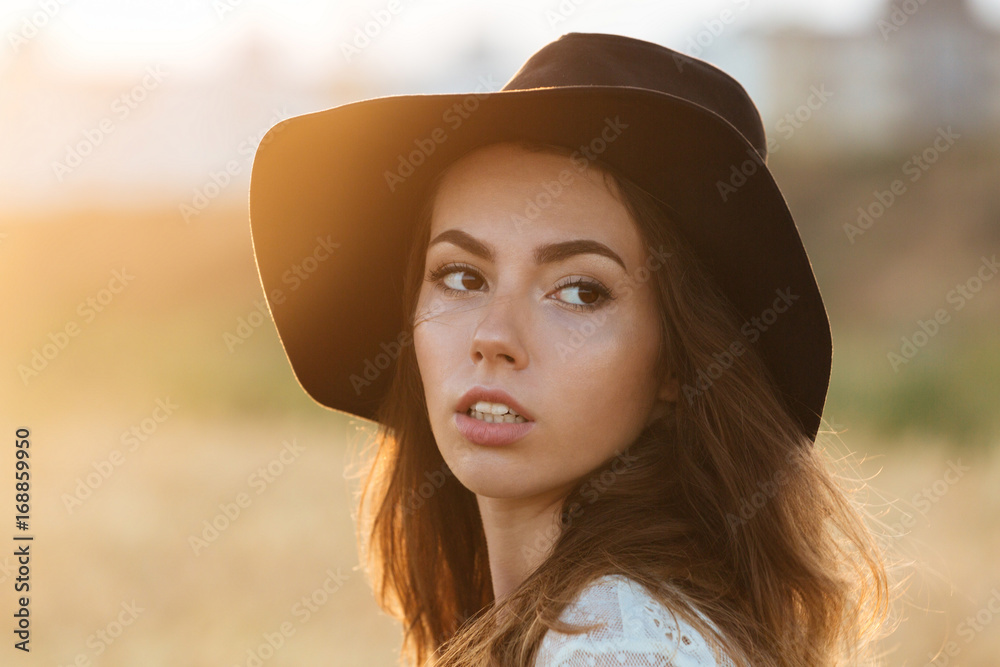Gorgeous young woman standing in the field