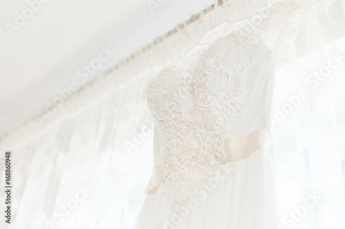 Details of wedding dress hanging