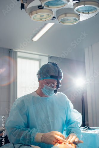 Portrait of a confident surgeon at work photo