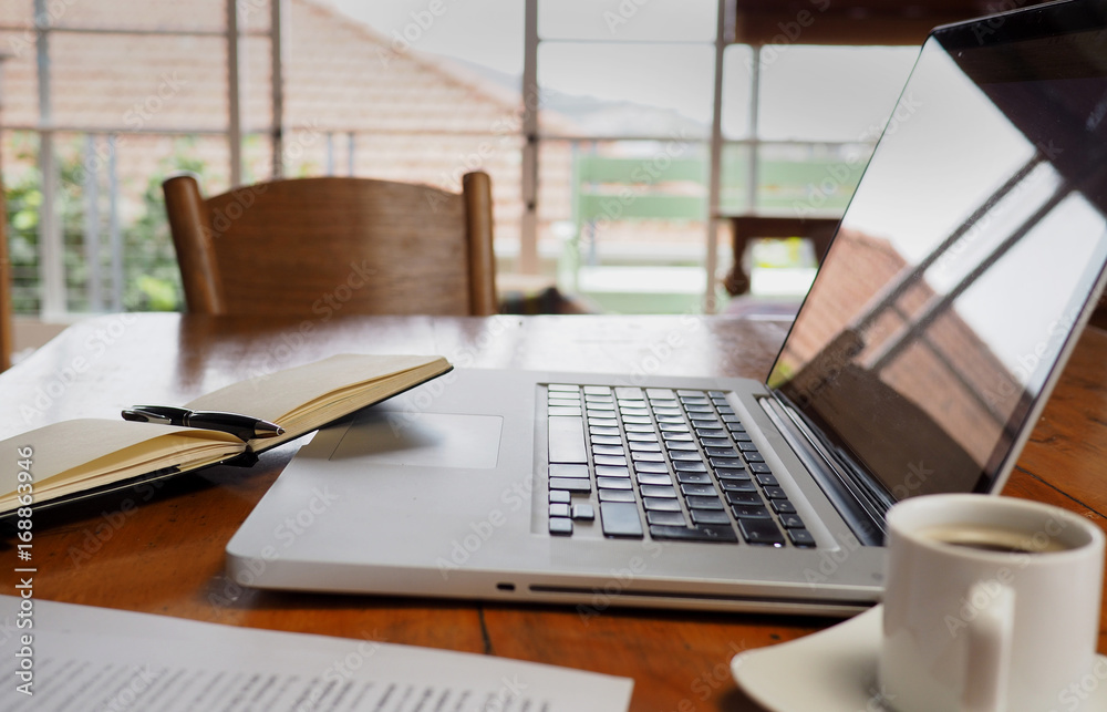 Laptop on table in home office Laptop on table in home office