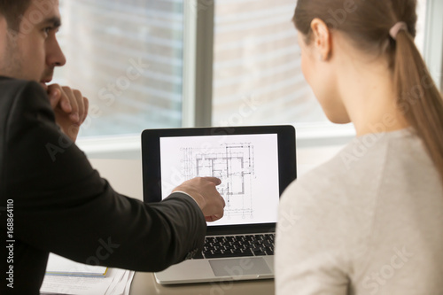 Billede på lærred Businesspeople discuss remodeling, building plan, talk about interior design, re