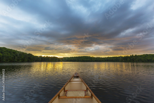 Canoe bow on a Canadian lake at sunset
