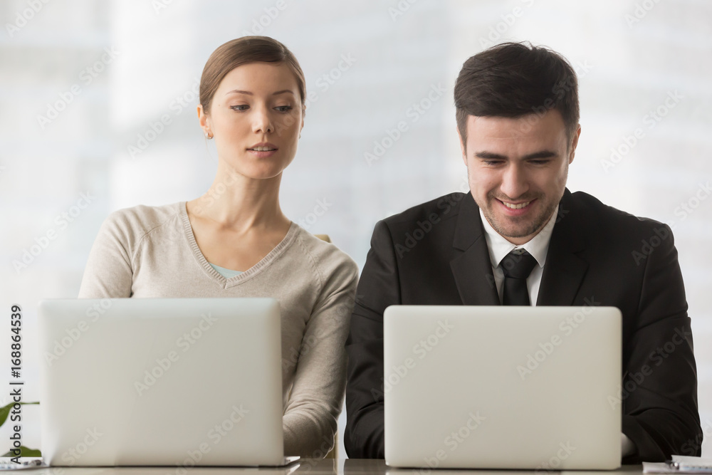 Interested curious corporate spy looking at colleagues laptop, spying on  rival, cheating on examination, stealing idea, sneaking peek, taking  inquisitive glance at computer screen of unaware coworker Stock Photo |  Adobe Stock