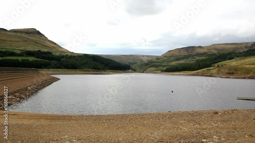 Dovestone reservoir with Saddleworth Moor at end of summer. The reservoir is at a low level following a relatively dry summer in 2013, but not yet so low as to cause concern about water supplies. photo