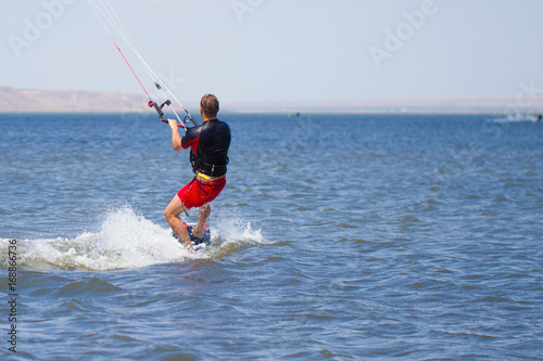 Man is engaged in kitesurfing