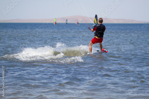 Man is engaged in kitesurfing