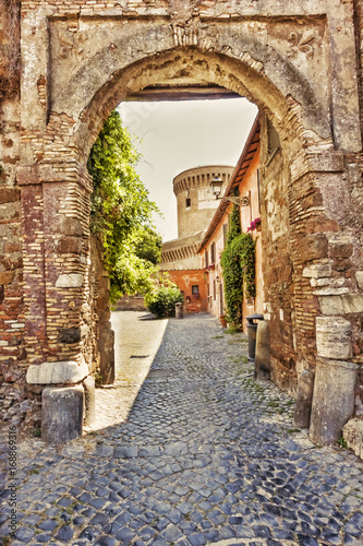 Fototapeta Naklejka Na Ścianę i Meble -  Old main gate to the medieval village of Ostia Antica - Rome, Italy