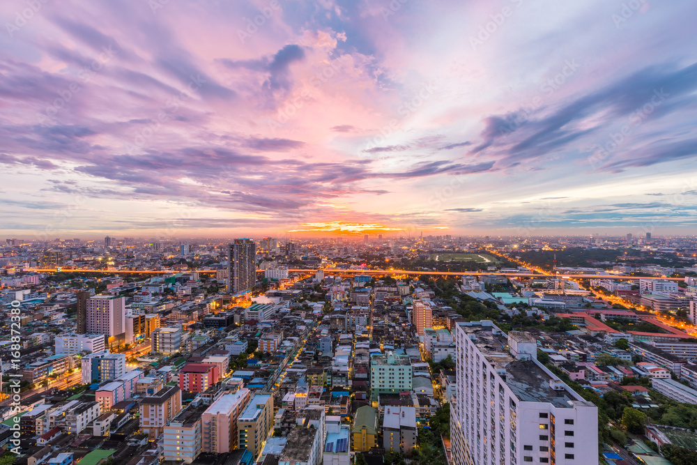 Top view Beautiful Bangkok Cityscape with Sunset, cloud and sky at Thailand.  Business modern district