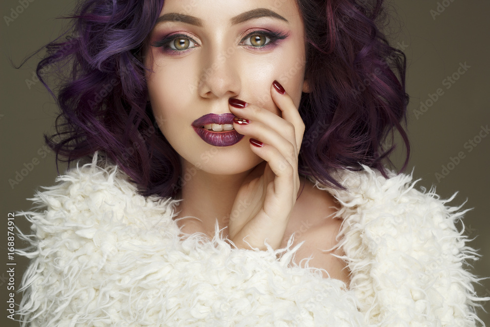 Portrait of beautiful sexy fashion model with purple hair over grey background Portrait of beautiful sexy fashion model with purple hair over grey background