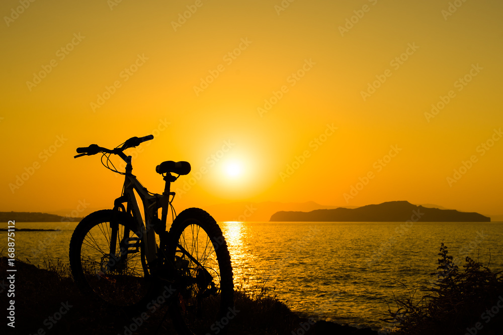 Picture of bicycle on the sunset sea overview