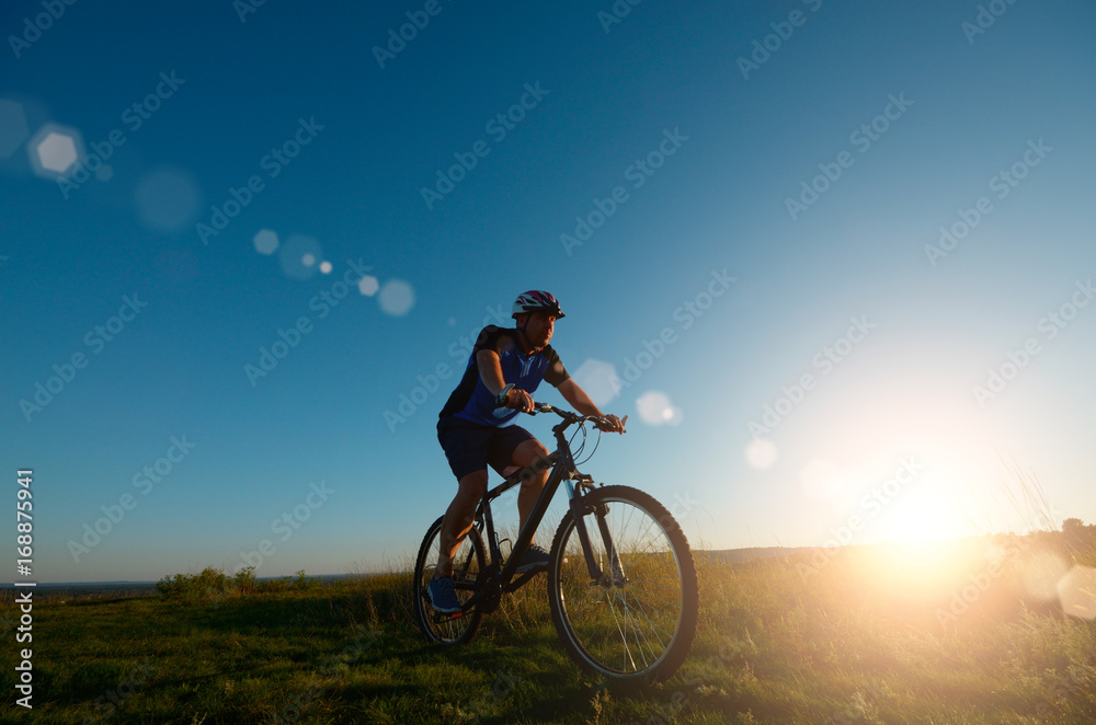 Male cyclist driving outdoors Male cyclist driving outdoors