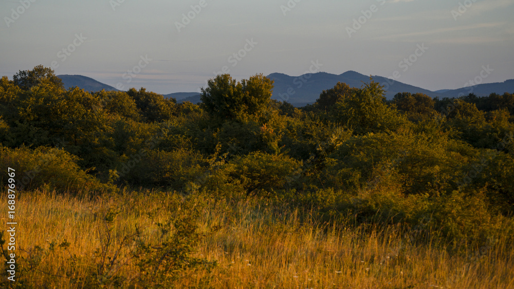 view of mountain silhouette on twilight sky after sunset, summer landscape of hills outdoor
