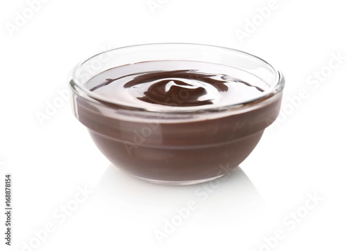 Bowl with delicious chocolate sauce on white background