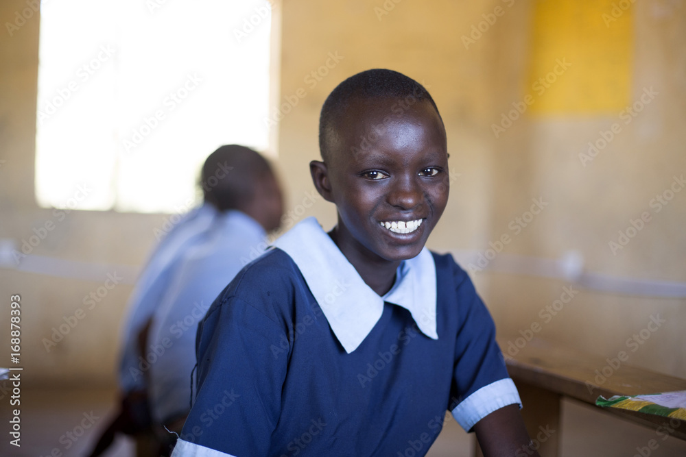 © Hugh Sitton - Portrait of smiling school girl in classroom