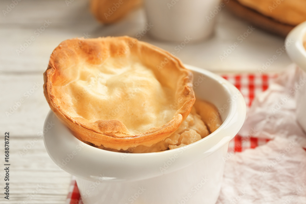 Baking dish with delicious turkey pie on table Baking dish with delicious turkey pie on table