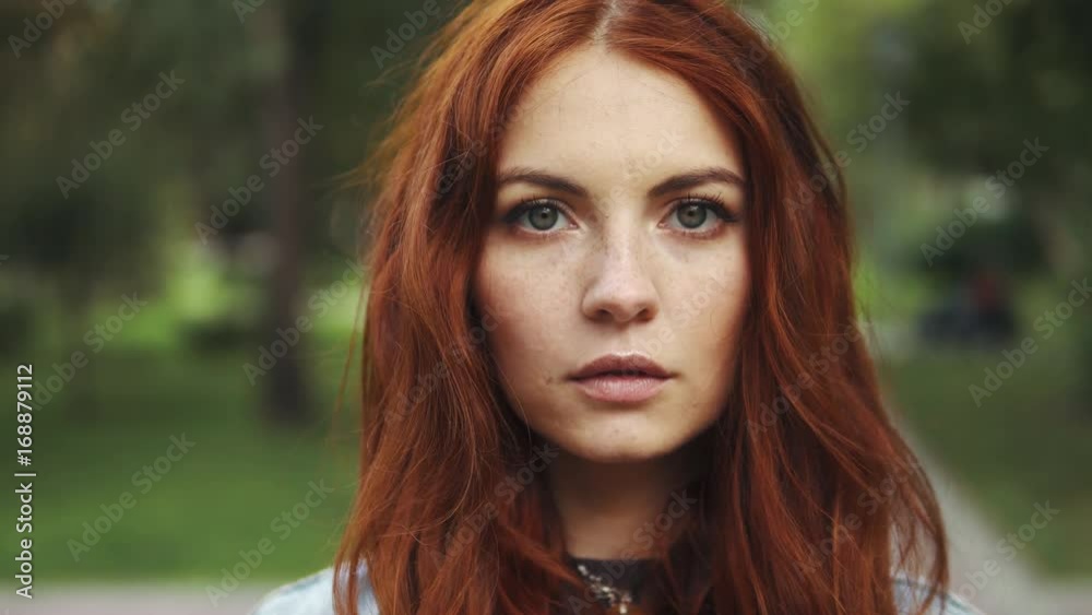 sensual closeup portrait of beautiful red-haired girl in a summer Park. 20s sensual closeup portrait of beautiful red-haired girl in a summer Park. 20s
