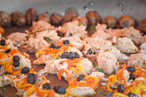 Codfish in baking with peppers and olives. photo